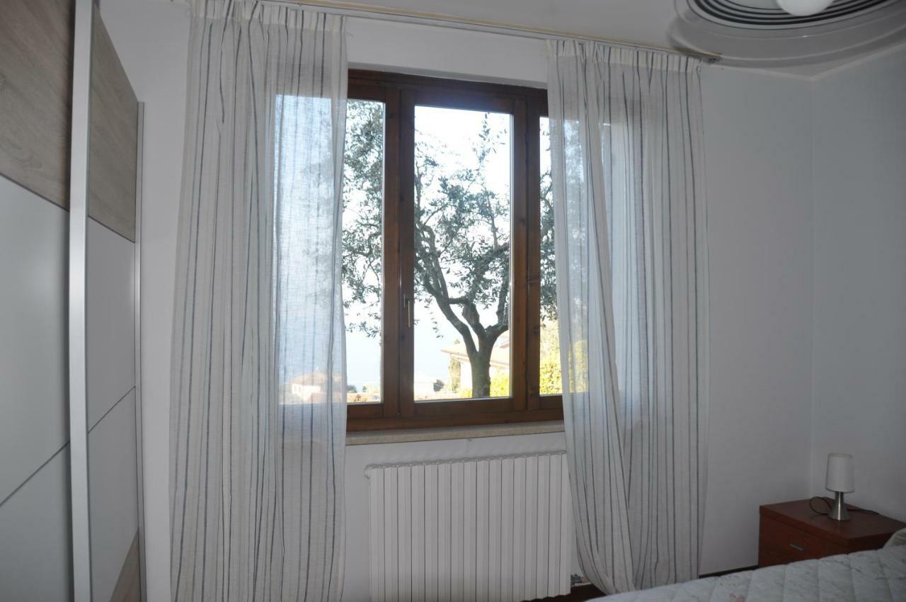 Appartamento Lago Di Garda Albisano ตอร์รีเดลเบนาโก ภายนอก รูปภาพ